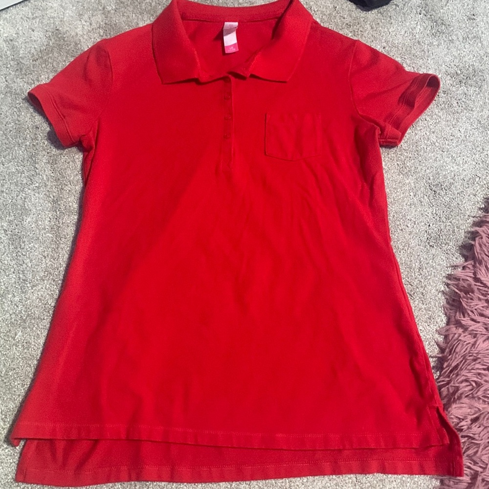 A red polo button up that is 95% cotton.